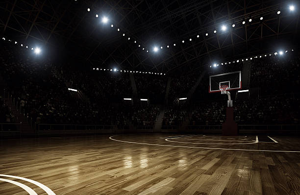 Basketball arena Indoor floodlit basketball arena full of spectators - full 3D sports court stock pictures, royalty-free photos & images