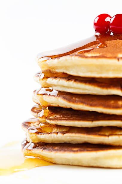 istock Pancakes with honey and cranberries on a plate. 464850112