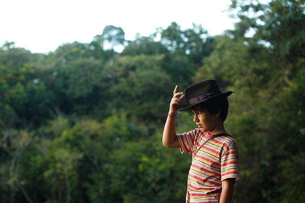 istock Boy taking adventurer hat watching the scenery . 464852400