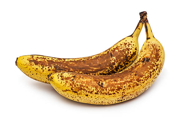 Bananas expired Overripe two bananas. Banana expired. Isolated on white background. bruised fruit stock pictures, royalty-free photos & images