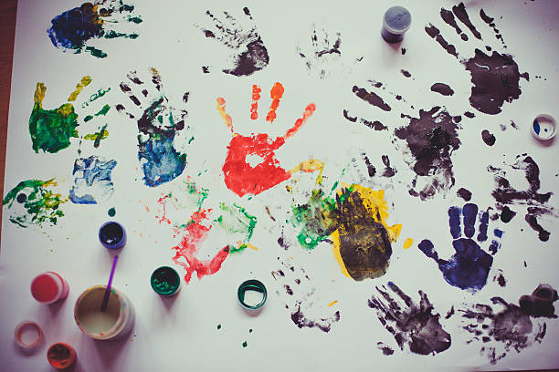 istock Many painted hands on the paper 464854272