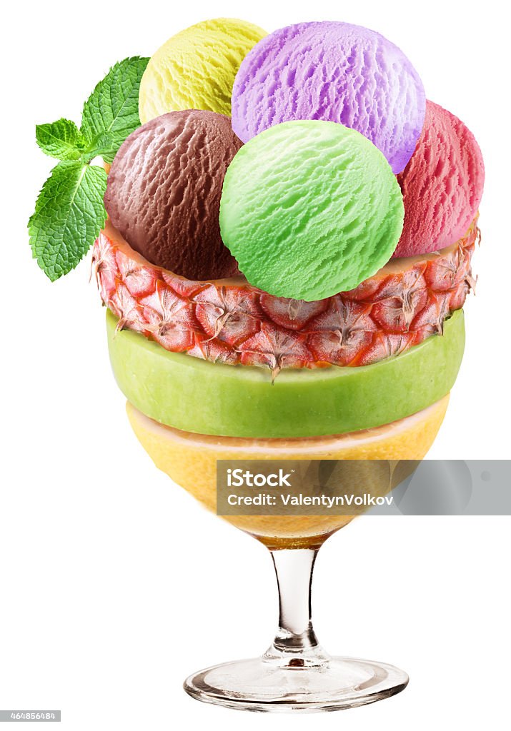 Ice cream scoops over fruit slices. Ice cream scoops over fruit slices. File contains clipping paths. 2015 Stock Photo