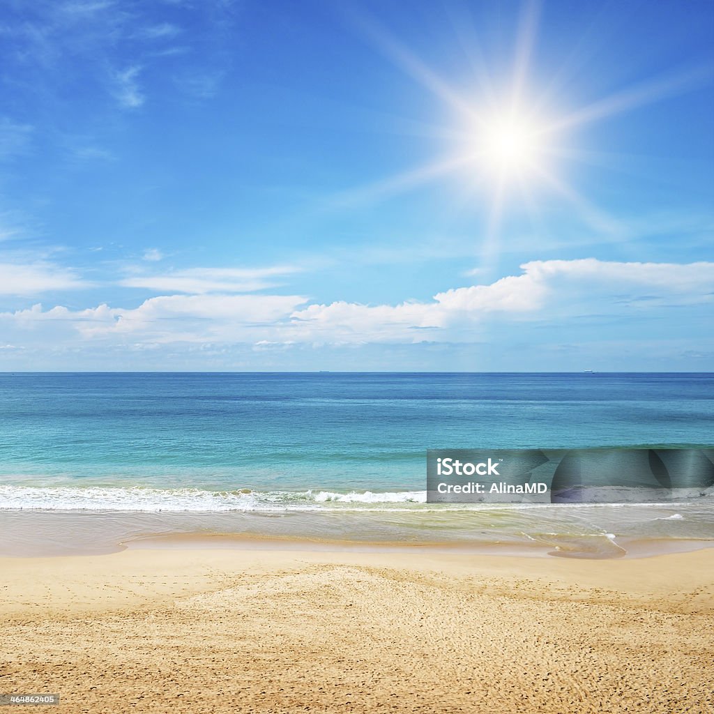 seascape and sun on blue sky background beautiful seascape and sun on blue sky background Beach Stock Photo