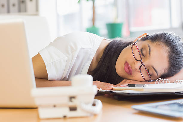 istock Overworked businesswoman sleeping on desk 464866546
