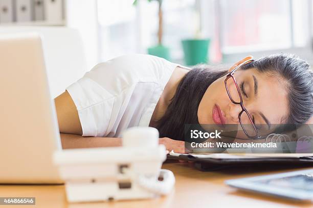 Overworked Businesswoman Sleeping On Desk Stock Photo - Download Image Now - Beautiful Woman, Office, Sleeping