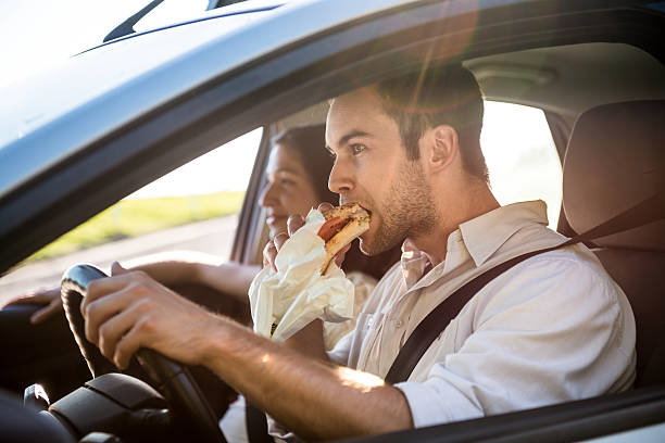 Eating in car stock photo