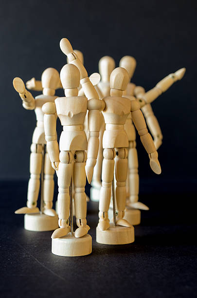 istock Grouping of artist manikins side lit on black 464869692