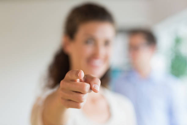 istock Businesswoman pointing in office 464869914