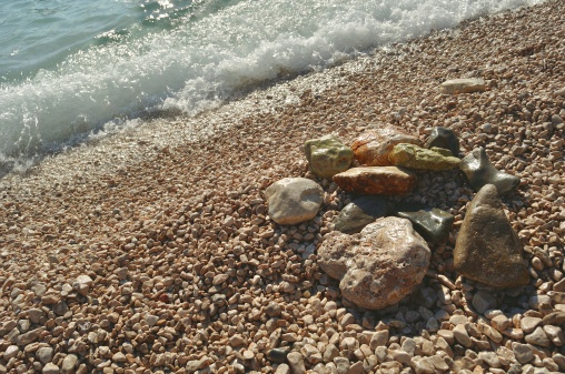 Stones on the beach with wave