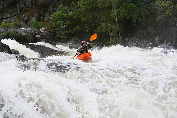 istock Woman kayaking in river 464874190