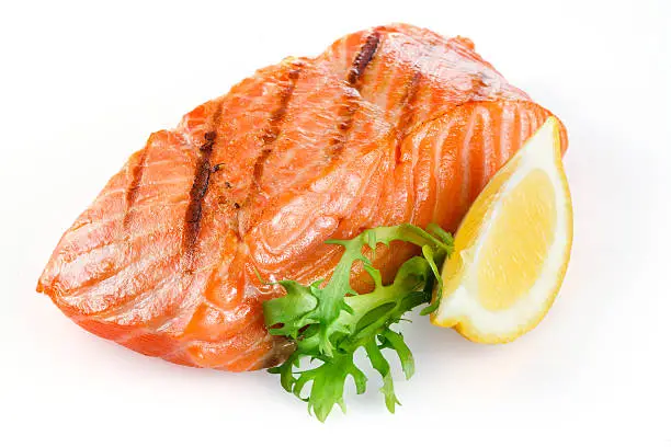 Grilled salmon with lemon isolated on white