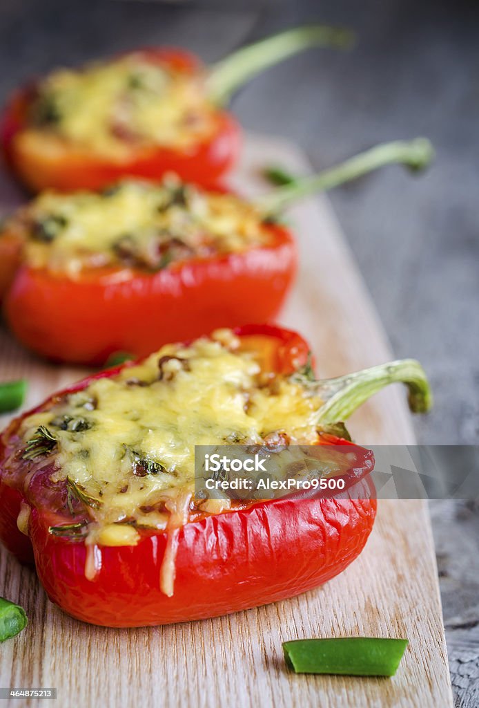 Stuffed peppers with meat presented on a wooden board  Stuffed pepper with meat Stuffed Pepper Stock Photo