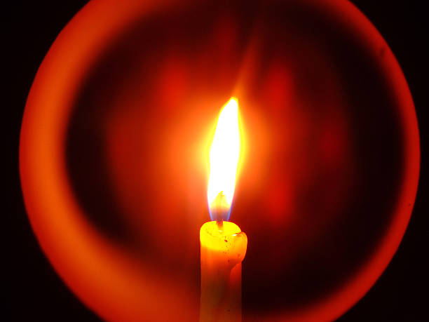 istock Close up of Candle with red background 464875683