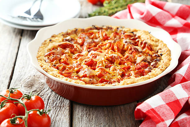 istock Fresh tomato pie on grey wooden background 464877044