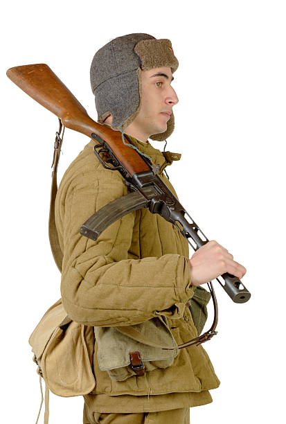 istock young Soviet soldier with machine gun ppsh-41 464877918