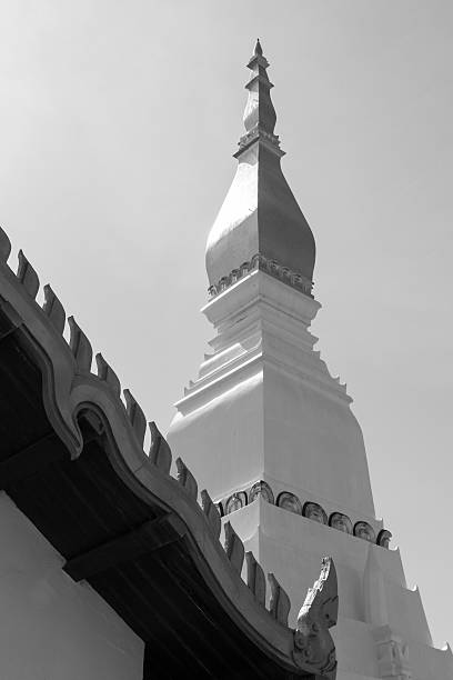 white buddhist pagoda near temple roof, black and white