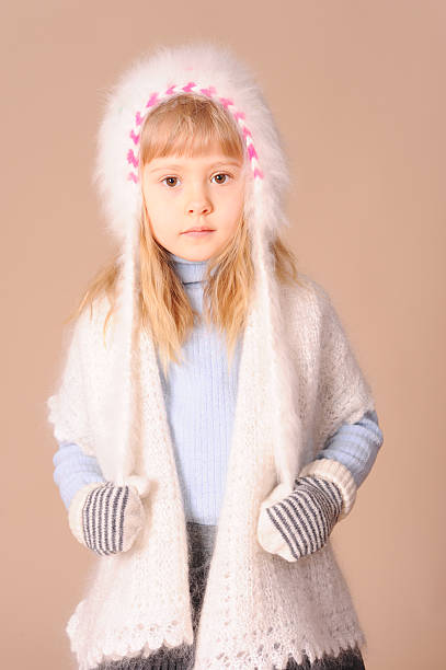 istock Cute kid girl wearing winter hat in studio 464883685