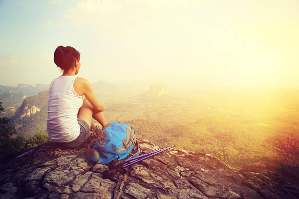 istock hiking woman enjoy the view on mountain peak 464886408