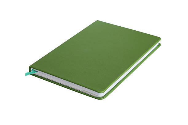 istock Thick green book isolated on white background 464886734