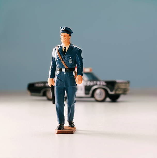 istock Policeman in Front of Car 464886802