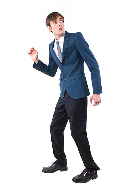 istock Businessman Scared and Looking at Danger from Above 464890125