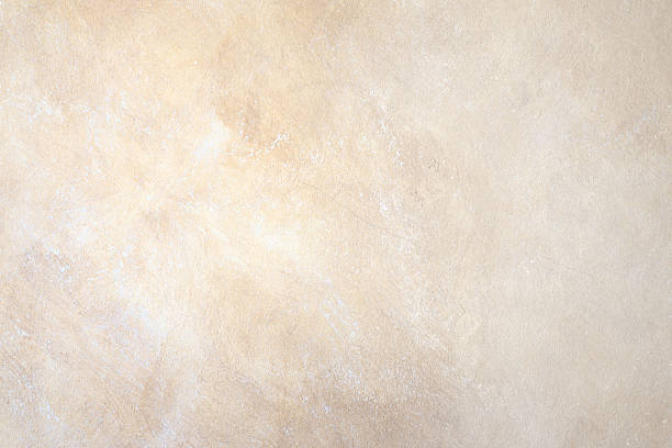 A background wall of abstract rock in beige stock photo
