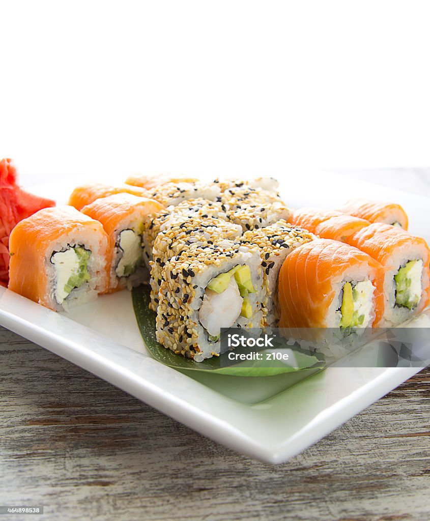 Seafood Maki sushi in white plate isolated on white background 2015 Stock Photo