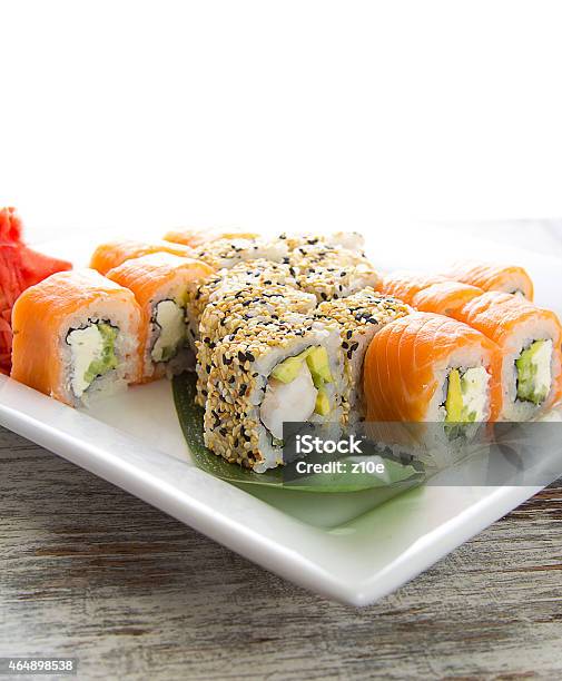 Seafood Maki Sushi In White Plate Isolated On White Background Stock Photo - Download Image Now