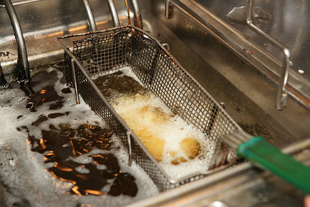 istock Deep fryer with boiling oil in a restaurant 464899429