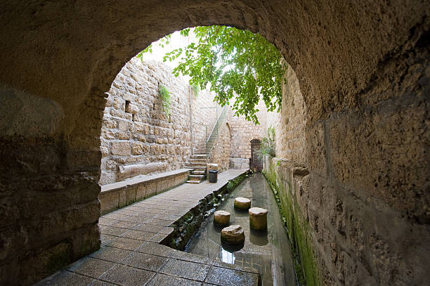 The pool of Siloam at the end of Hezekiah's tunnel is a rock-cut pool on the southern slope of 'the City David' in Jerusalem