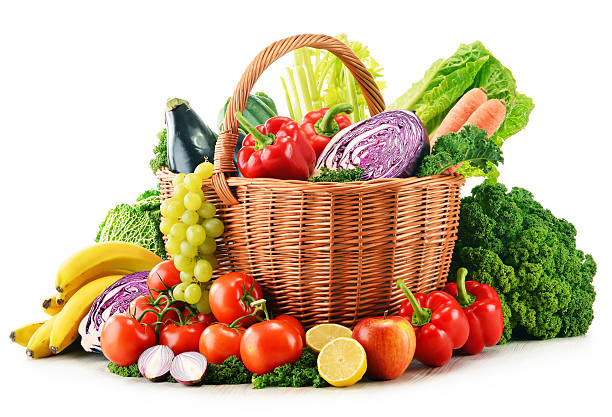 istock Wicker basket with assorted organic vegetables and fruits  isola 464901171