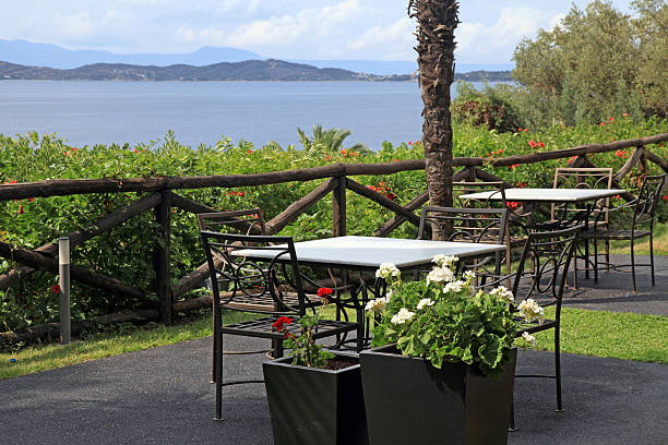 istock Tables and iron chairs on terrace with sea view (Greece) 464901461
