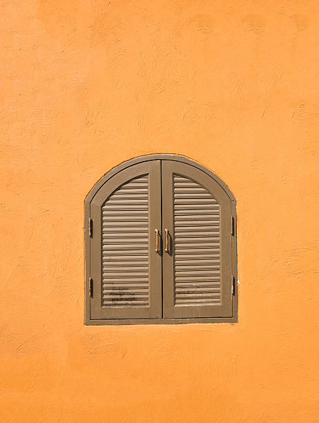 istock vintage windows on the orange wall 464902474
