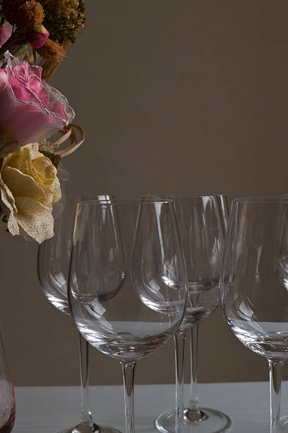 istock Still life of glasses and flowers. 464906113