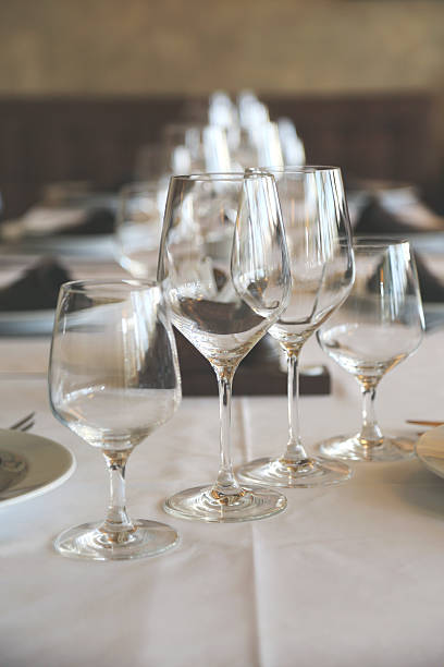 Table in restaurant white tablecloth wine glasses Empty glasses in restaurant on table indoors restaurant hotel work tool stock pictures, royalty-free photos & images