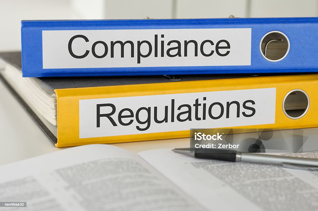 Folders with the label Compliance and Regulations Obedience Stock Photo