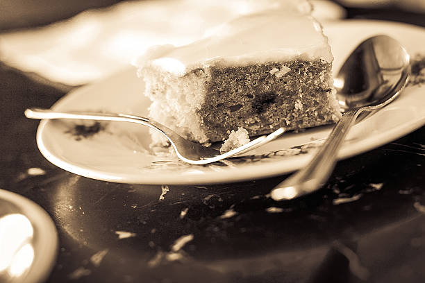 istock Sepia Half eaten cake with silver spoon 464906904