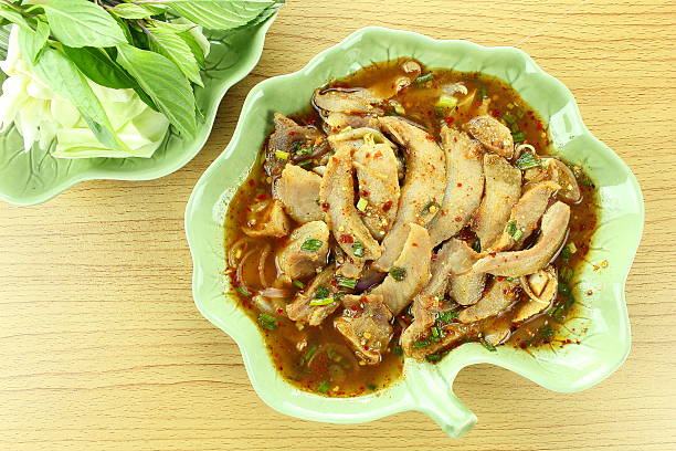 istock thai spicy grilled pork salad 464907430