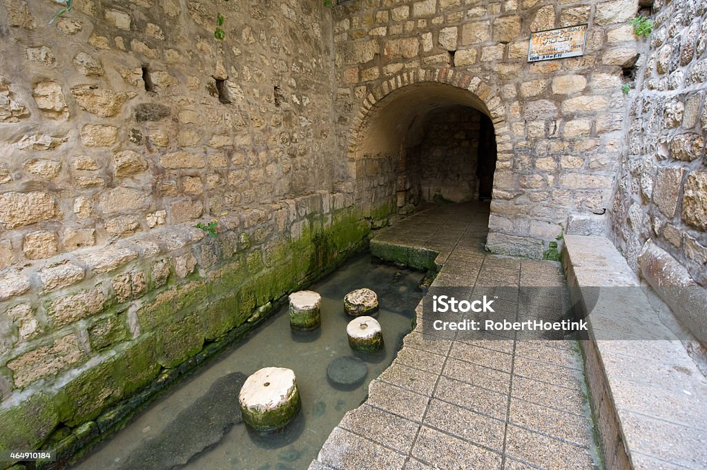 The pool of Siloam The pool of Siloam at the end of Hezekiah's tunnel is a rock-cut pool on the southern slope of 'the City David' in Jerusalem Tunnel Stock Photo