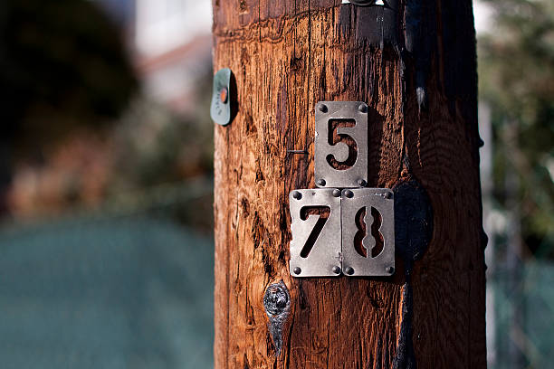 istock Wooden transmission post with numbers on it 464912033