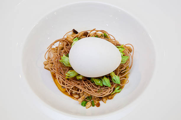 istock Crispy noodles topped with a soft-boiled egg. 464912489
