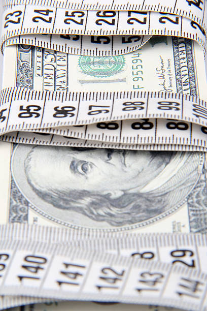 istock Money and Tape Measure- two 464912521