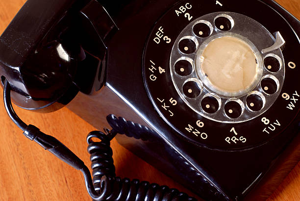 close up of a dusty old black telephone stock photo