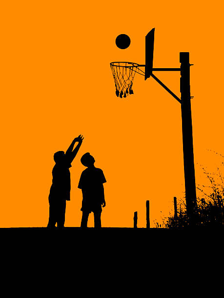 Kids playing basketball in the street