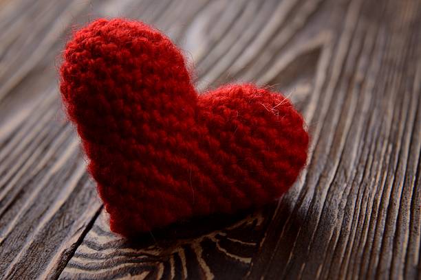 istock red heart on wooden background 464916985
