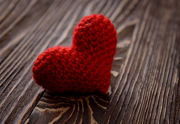 istock red heart on wooden background 464916999