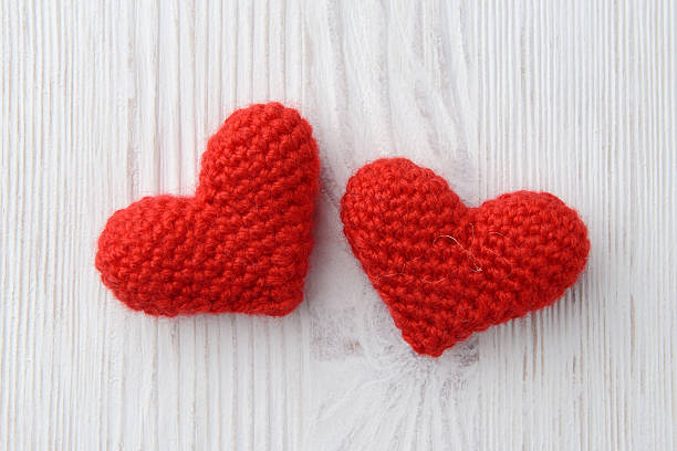 istock red hearts on white wooden background 464917111