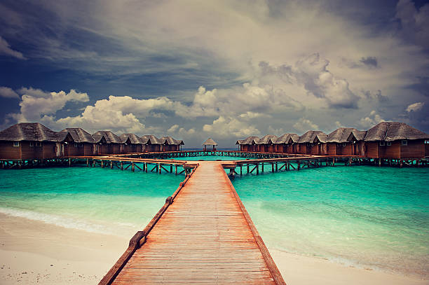 istock water bungalows in Maldives Islands 464917324