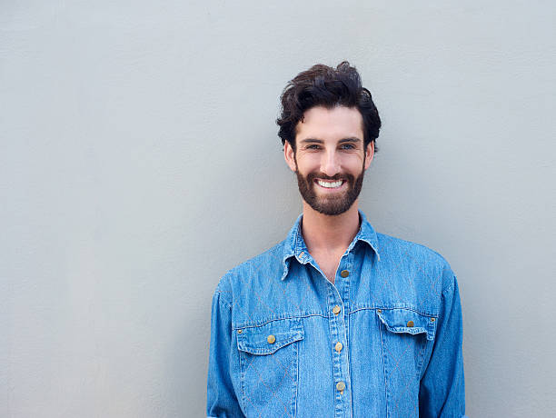istock Happy man smiling in blue shirt 464918532