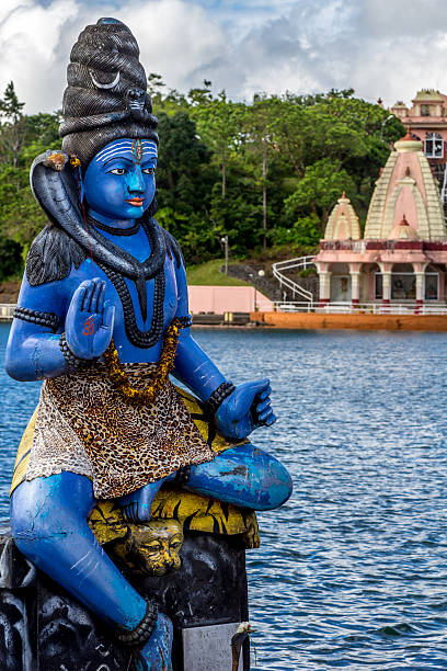 istock Blue Shiva statue and a temple 464920199